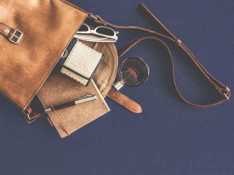 brown leather handbag with accessories