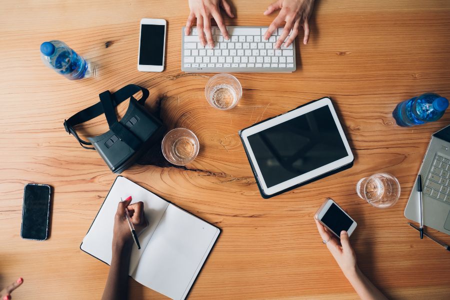 Technological work tools on table in office